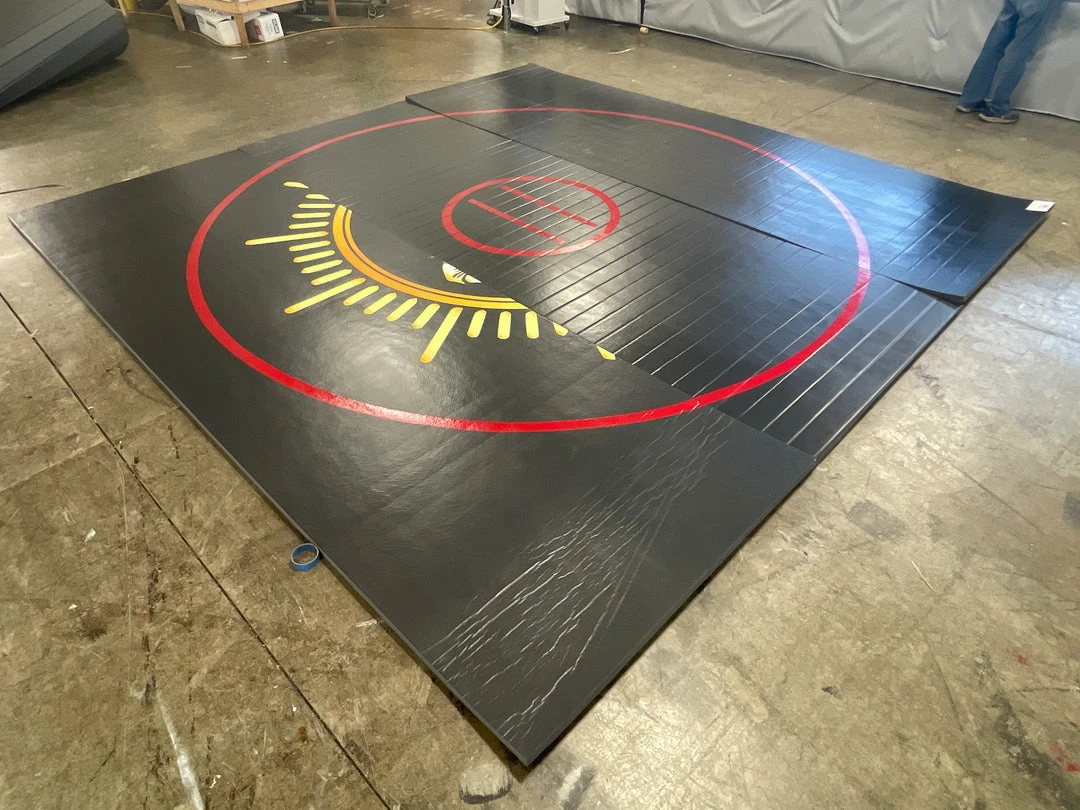 AK Athletic Equipment CLEARANCE 14' X 14' X 1 3/8" Roll Up Wrestling Mat - Black With Red Circles And Logo Wrestling Mats 1 AK Athletic Equipment CLEARANCE 14' X 14' X 1 3/8" Roll Up Wrestling Mat - Black With Red Circles And Logo Wrestling Mats