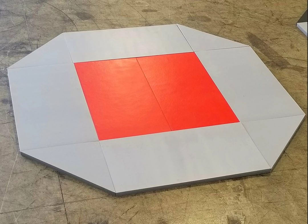 AK Athletic Equipment CLEARANCE 8' X 8' Remnant Octagon Wrestling Mat Gray And Red Vinyl 1 AK Athletic Equipment CLEARANCE 8' X 8' Remnant Octagon Wrestling Mat Gray And Red Vinyl